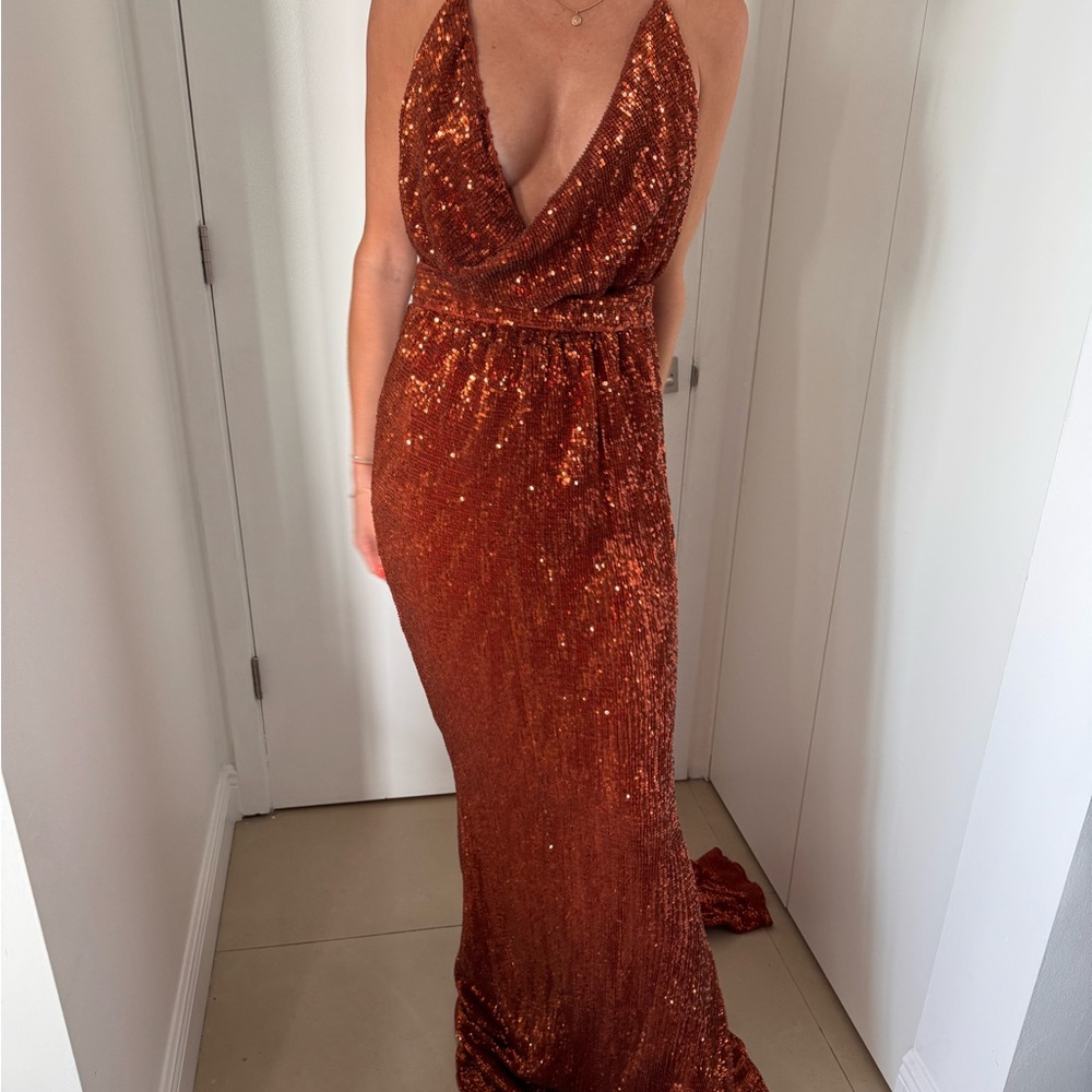 Floor length backless gown with sequins, halter top & short train